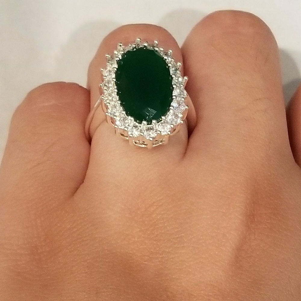 Silver Gold played ring with green sapphire